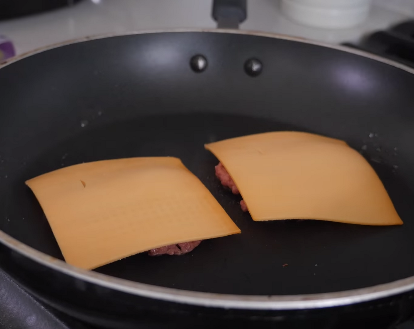 step 10 Cook French Fries (1 bag) and Vegan Burger Patty (1) according to package directions, melting a slice of Vegan Cheese (2 slices) over each of the burger patties at the end of their cook time.