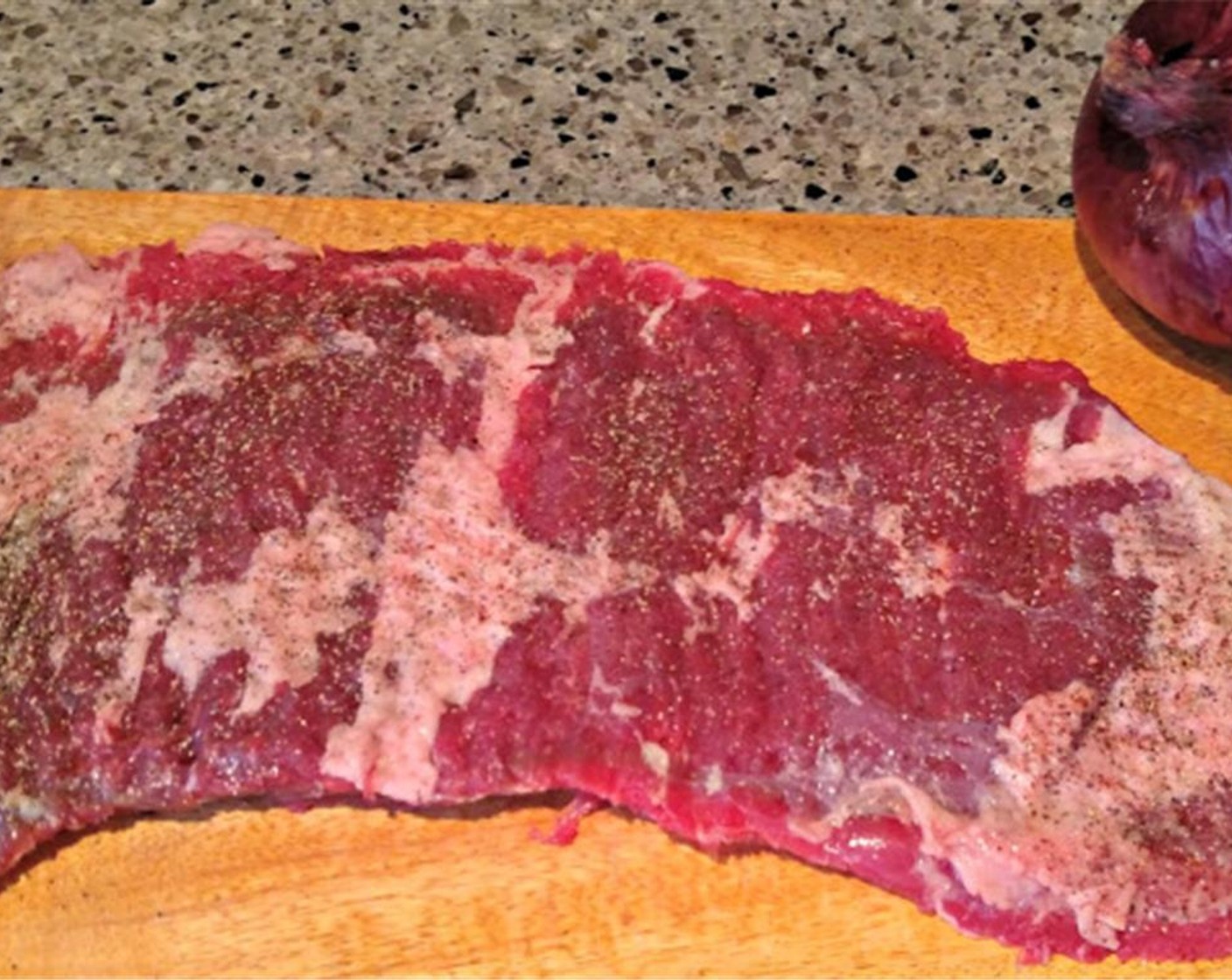 step 1 Tenderize Skirt Steak (1.3 lb) Lay it flat on a cutting board and cover with plastic wrap. Wack it with a meat tenderizer until it is the same thickness throughout. My steak ended up just a little over a half-inch thick.