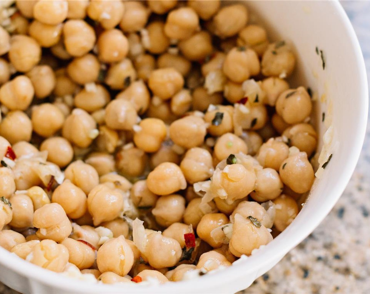 step 3 Combine in a small bowl with Olive Oil (1 Tbsp), juice of one Lemon (1), minced garlic, Crushed Red Pepper Flakes (1/4 tsp), Dried Basil (1 tsp) and Salt (1/2 tsp). Stir and place in the fridge to marinate while you prepare the rest of the salad.