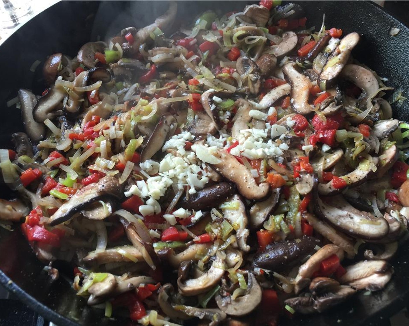 step 11 Add the garlic and sauté until fragrant.