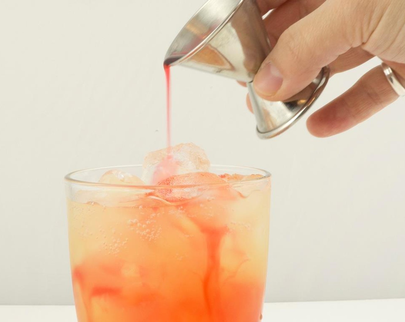 step 5 Top with Grenadine Syrup (0.5 fl oz).