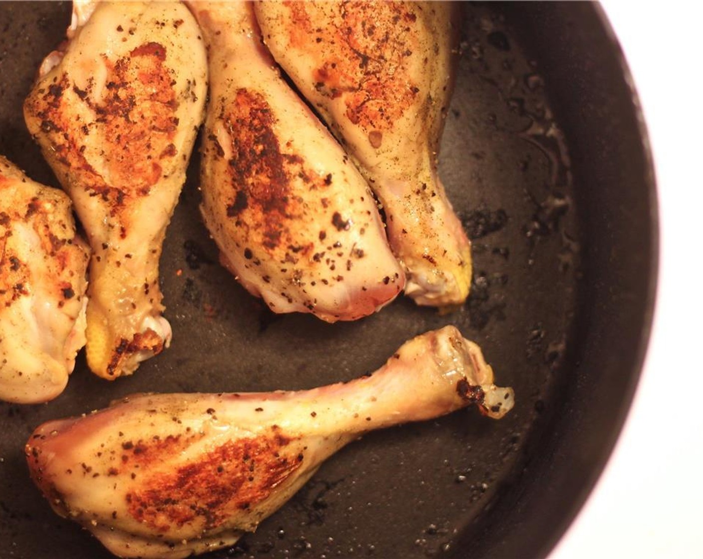 step 4 Remove the smoked turkey kielbasa and the Canadian bacon from the pan when crispy. Add the chicken drumsticks, turning as they brown. Remove the chicken from the pot and set the meat aside.