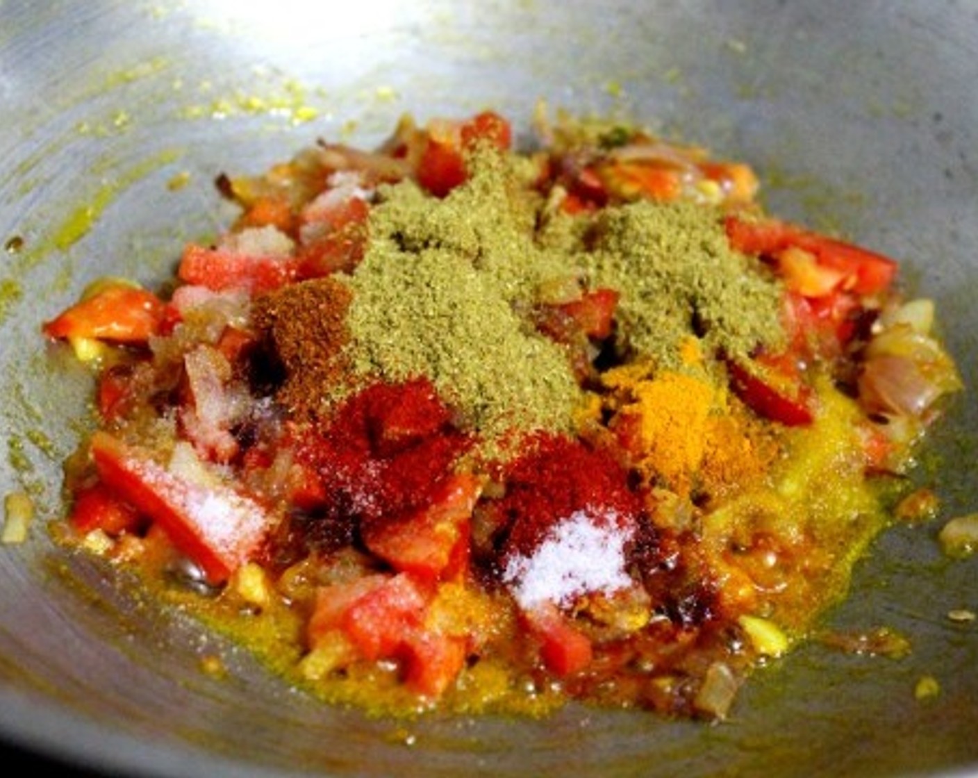 step 7 Add tomato, Green Peas (1/2 cup), Ground Coriander (2 tsp), Red Chili Powder (1 tsp), Garam Masala (1 tsp), Ground Turmeric (1/2 tsp) and cook till peas are done and oil begins to separate.