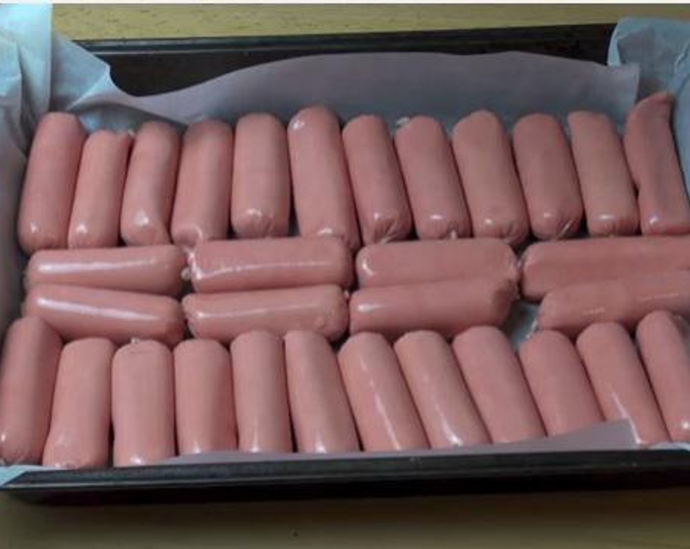step 2 Put your little Sausages (2.2 lb) on a baking tray lined with non stick baking paper.