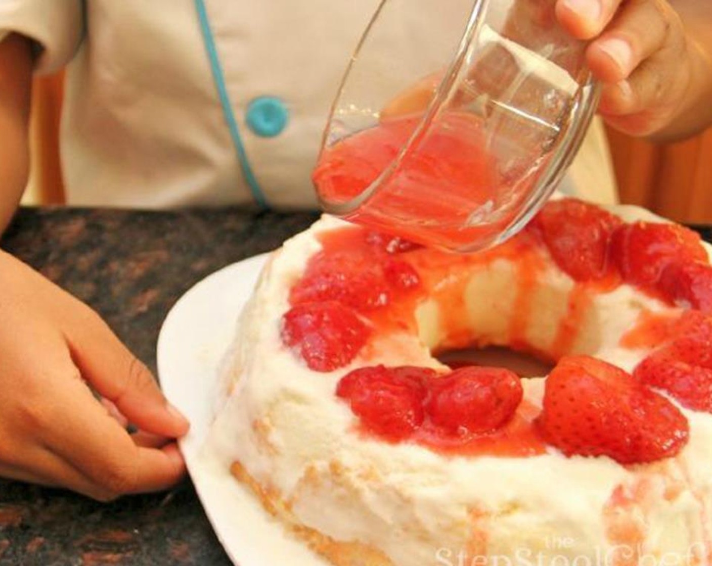 step 5 Then add a layer of Frozen Strawberries (2 cups) on the bottom half of the cake. You can even pour some of the juice over the strawberries.  This part is a lot of messy fun!