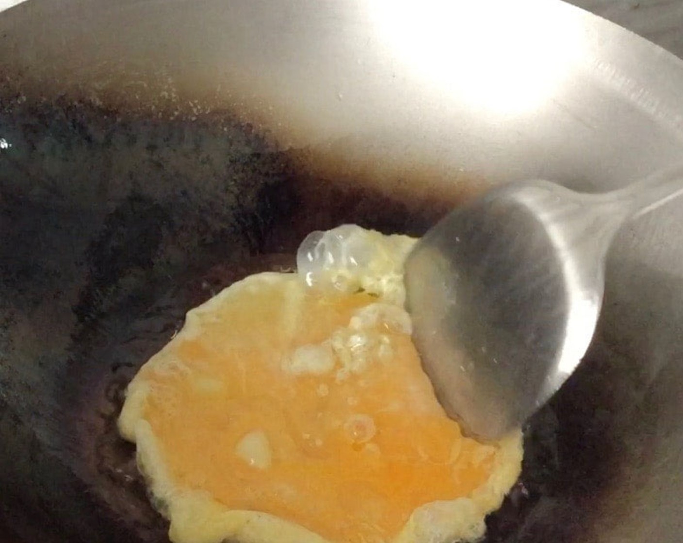 step 6 Add in eggs and scramble until egg is just set.