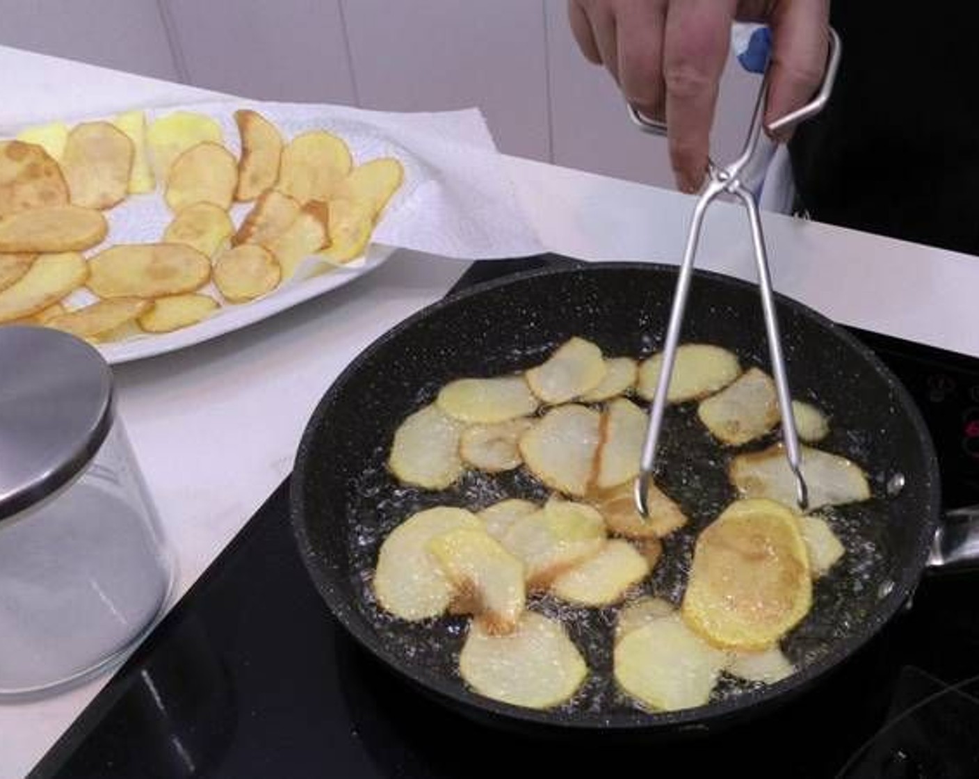 step 3 Fry in a pan with a very generous layer of Olive Oil (as needed). Remove them as they reach a golden color and place them on a plate with a paper towel to drain the excess oil.
