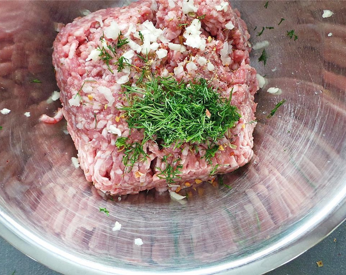 step 1 Add the Ground Lamb (1 lb), Fresh Dill (1 Tbsp), Mediterranean Spices (1/2 Tbsp), Crushed Red Pepper Flakes (1 pinch), Salt (to taste), and Ground Black Pepper (to taste) to a large bowl.