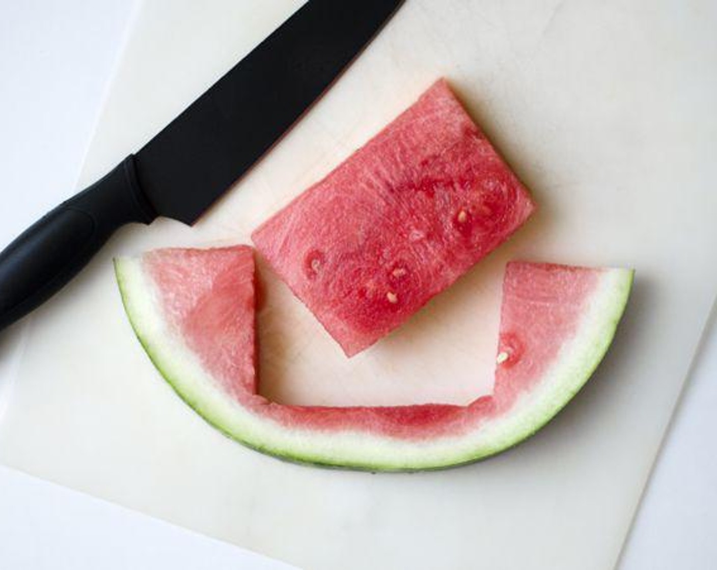 step 1 Cut Seedless Watermelon (1/2) in half lengthwise. Place flat side down, and cut 1 1/2 to 2-inch wide slices, erring on the side of too wide. Cut the largest rectangle possible from each of these slices. You should be able to get about 6 good steaks from 1/2 a watermelon.