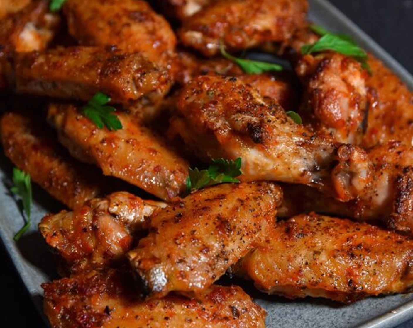 step 5 When the wings are done, transfer them to a bowl and add the warm sauce. Toss until they're evenly coated. If desired, roast for an additional 5 minutes.