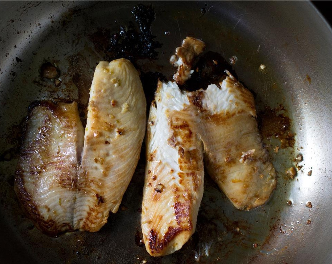 step 9 In a large skillet, heat Olive Oil (2 Tbsp) over medium-high heat. Working in batches, add the tilapia fillets cooking 4 to 5 minutes per side – until white and opaque.  Transfer the fish to a plate and break it up into large pieces.