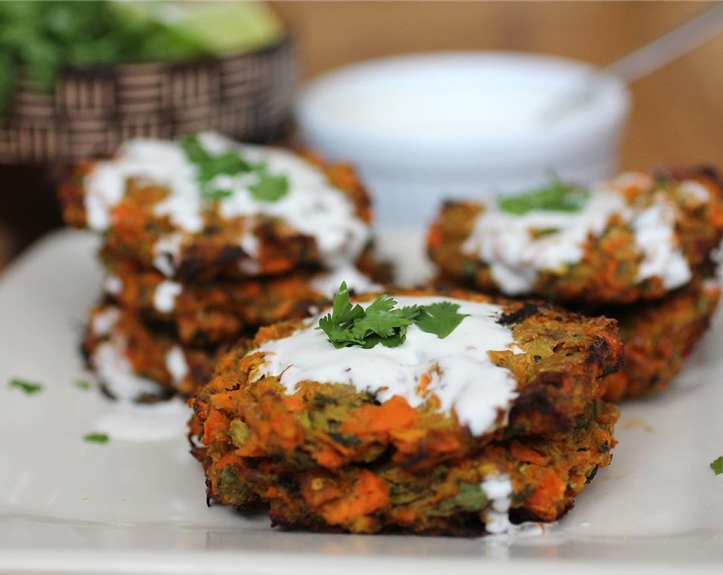 step 13 Serve the fritters topped with ginger coconut sauce and a touch of cilantro for garnish. Enjoy!