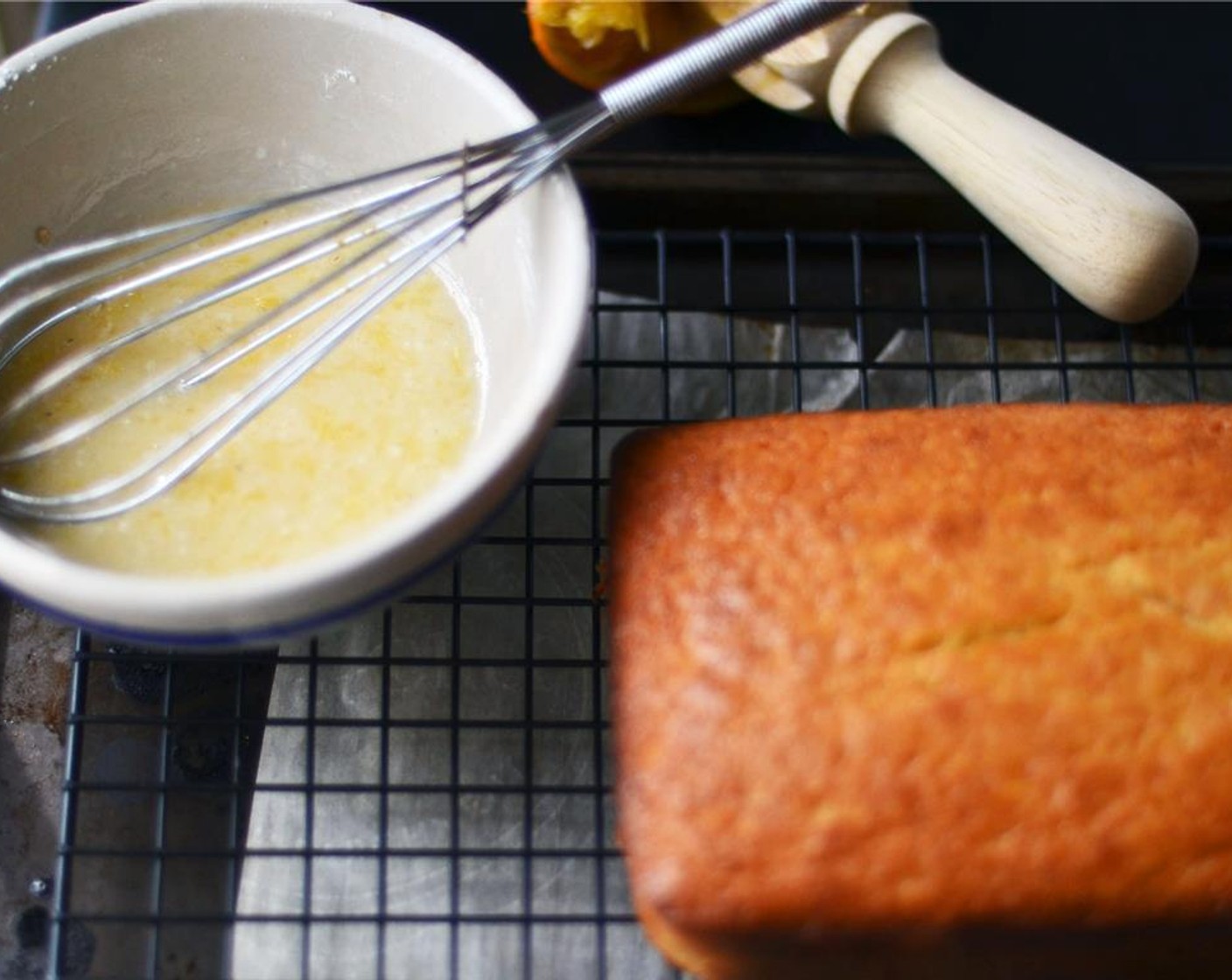 step 8 To make the glaze, sift Powdered Confectioners Sugar (1 cup) into a small bowl. Add 2 1/2 Tbsp of juice from Orange (1) and whisk until smooth.