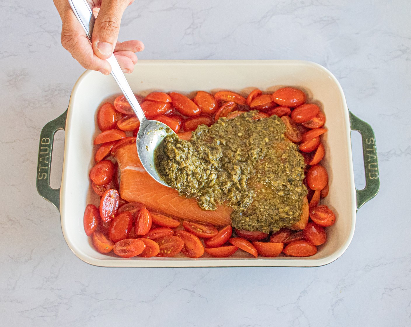 step 5 With a spoon, spread the Basil Pesto (1/3 cup) over the salmon.