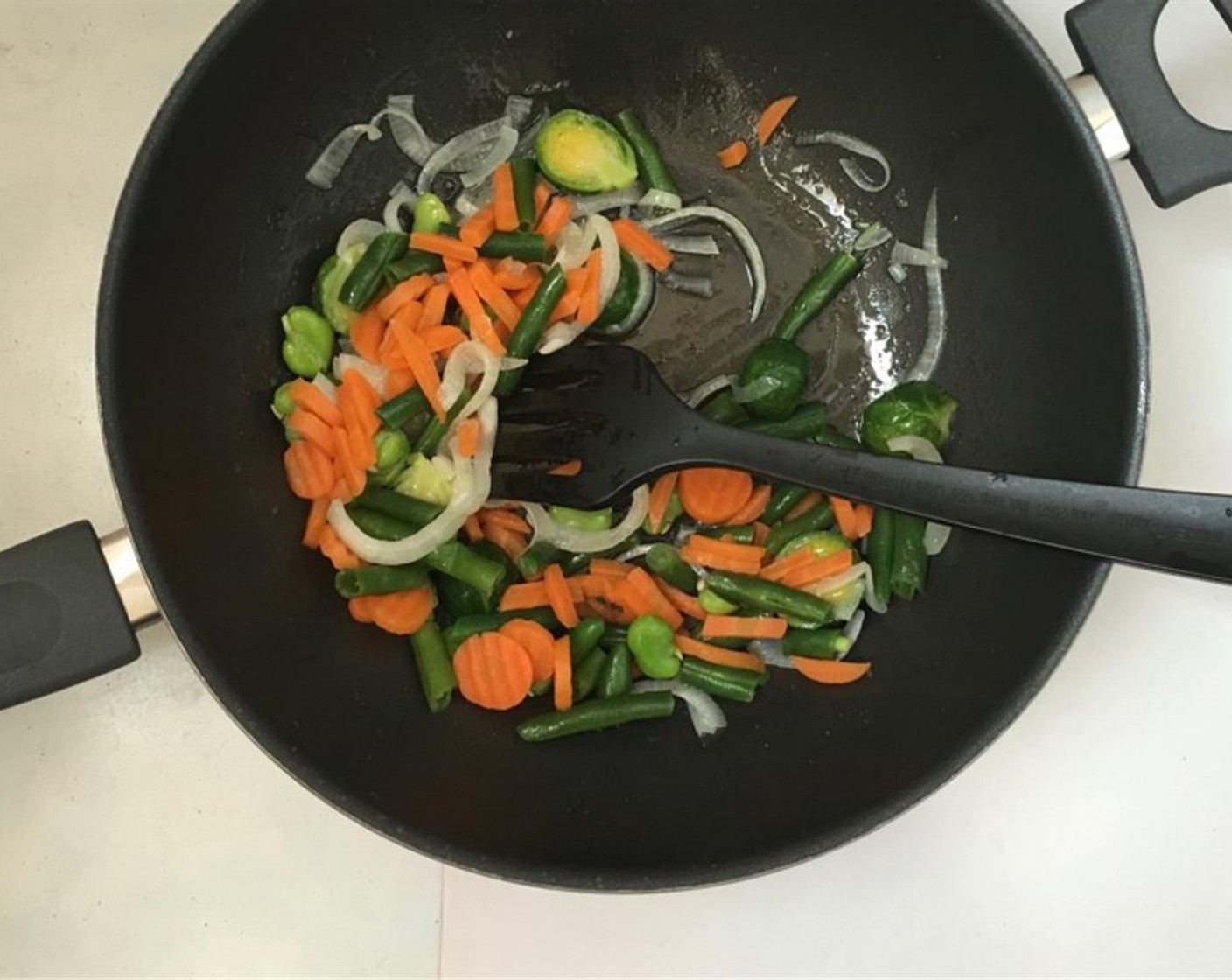 step 2 Add Green Beans (1/2 cup) and Carrot (1/3 cup) to the pan. Stir well. Let the vegetables fry for 3 more minutes. Don’t burn them.