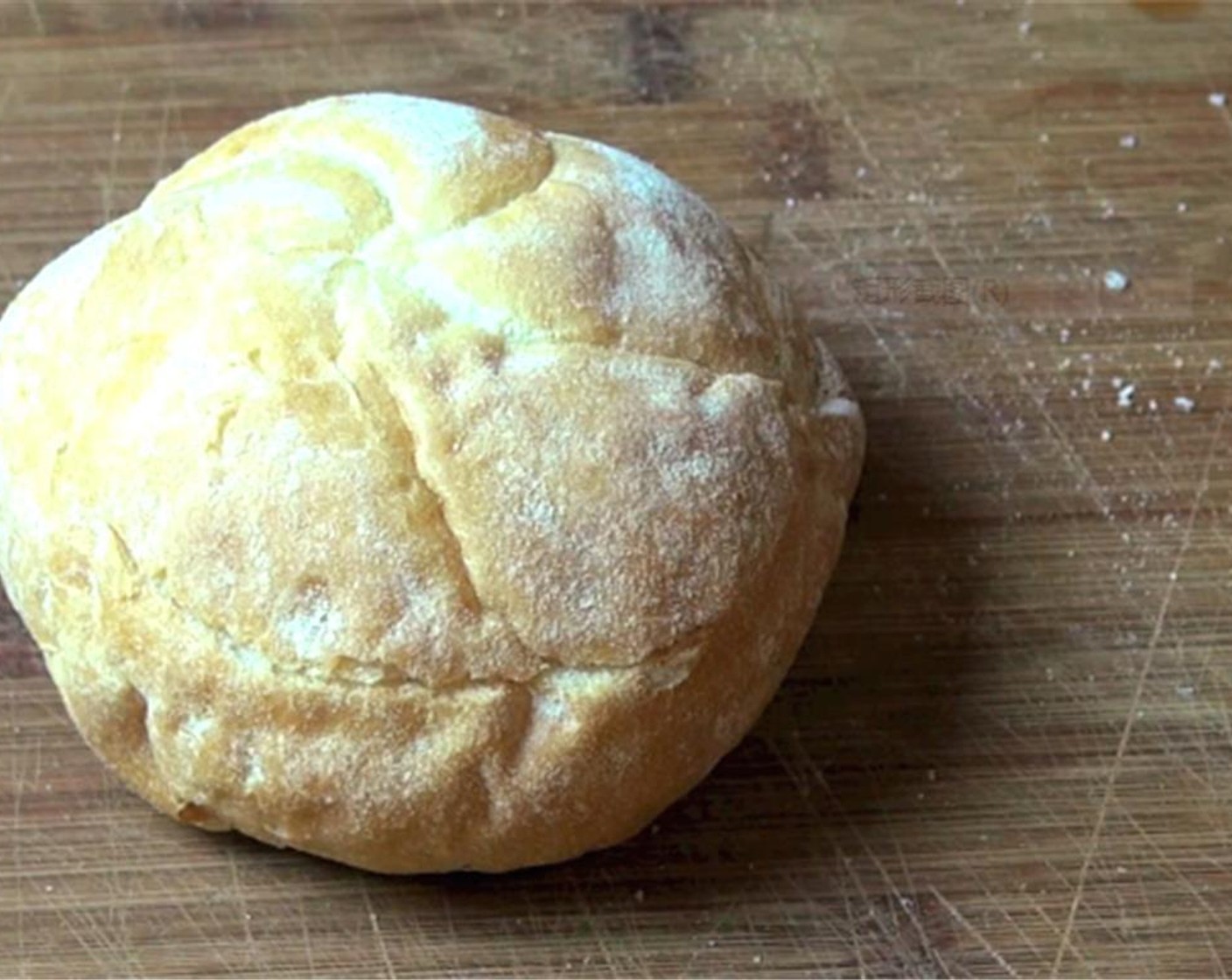 step 1 Preheat oven to 350 degrees F (180 degrees C). Cut the lid off the top of the Bread Roll (1). Scoop out the bread from the center of the bread roll.