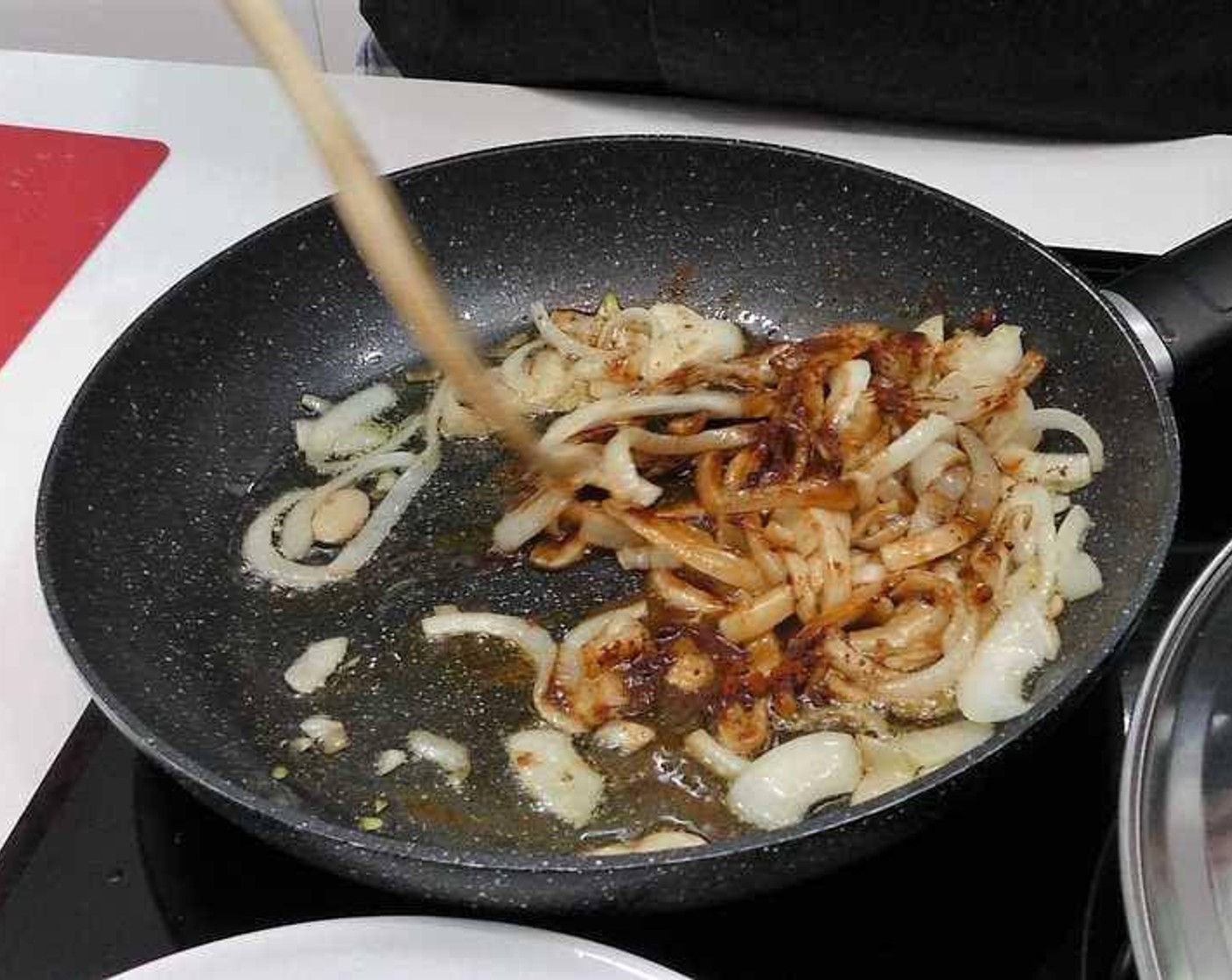 step 5 Add the onions and Garlic (2 cloves) to a pan with Olive Oil (as needed), and a pinch of Salt (to taste). Stir until onions start turning translucent and soft. Add Paprika (1 tsp) and stir for 10-15 seconds continuously.