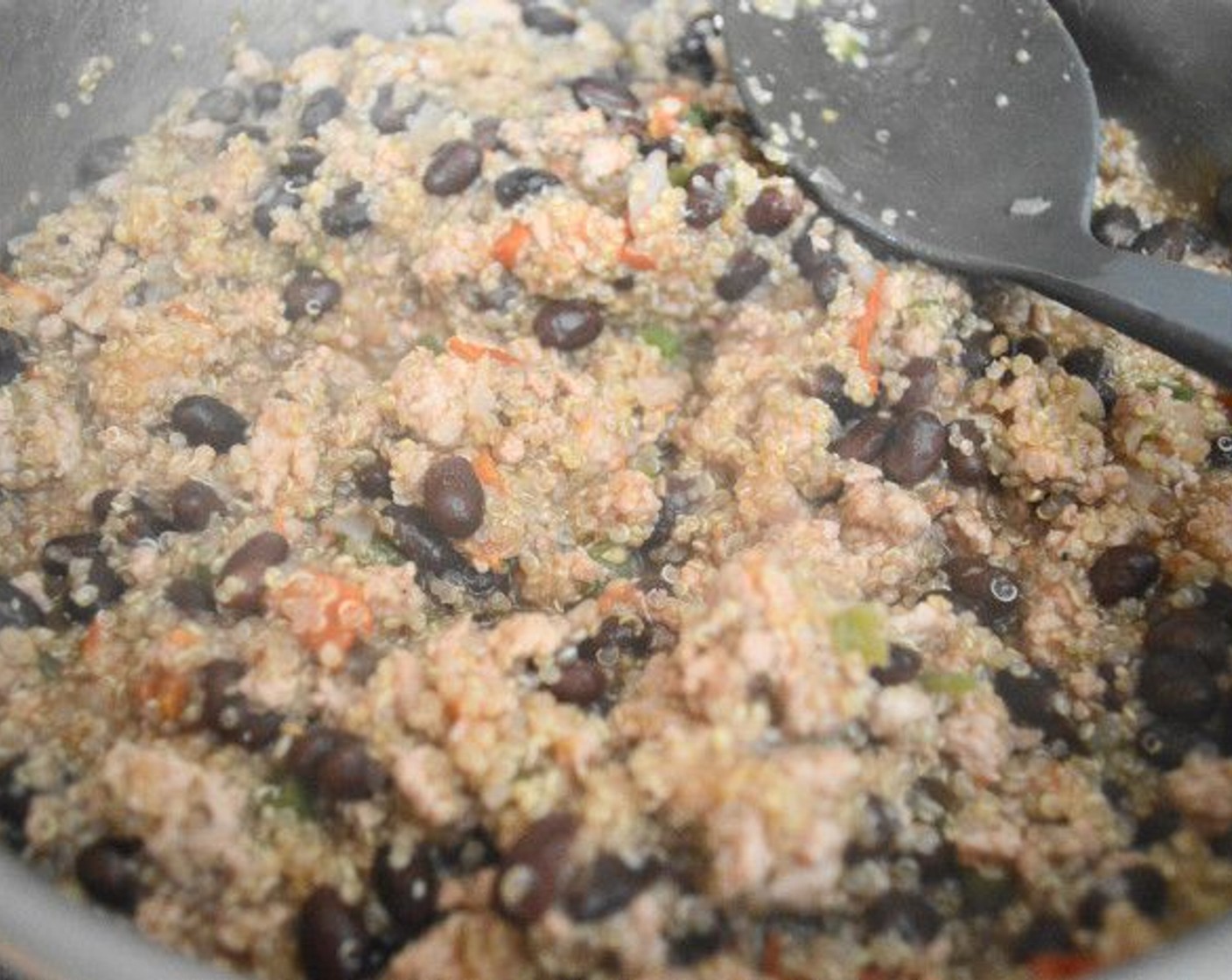 step 7 Then add in the GOYA® Black Beans (1 can) and zest and juice of the Lime (1). Let the mixture come to a low boil, then reduce the heat to a simmer and let it all simmer for 10 minutes.