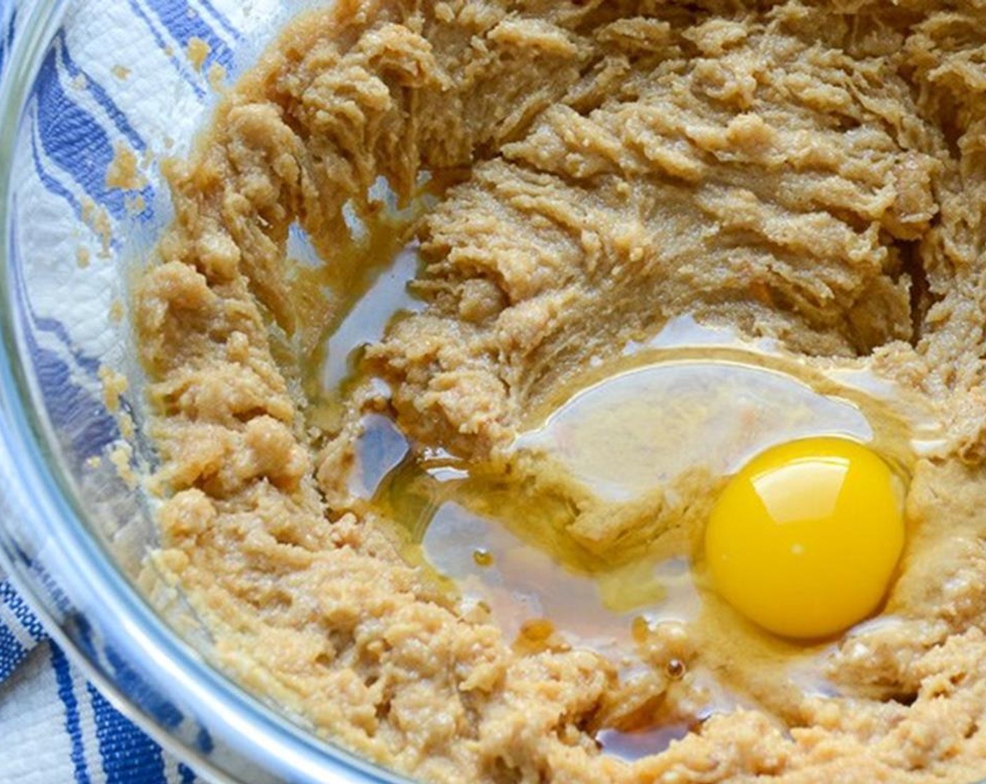 step 2 Combine in a large bowl the Unsalted Butter (1/2 cup), Chunky Peanut Butter (1/2 cup), Granulated Sugar (1/2 cup), and Brown Sugar (1/2 cup).