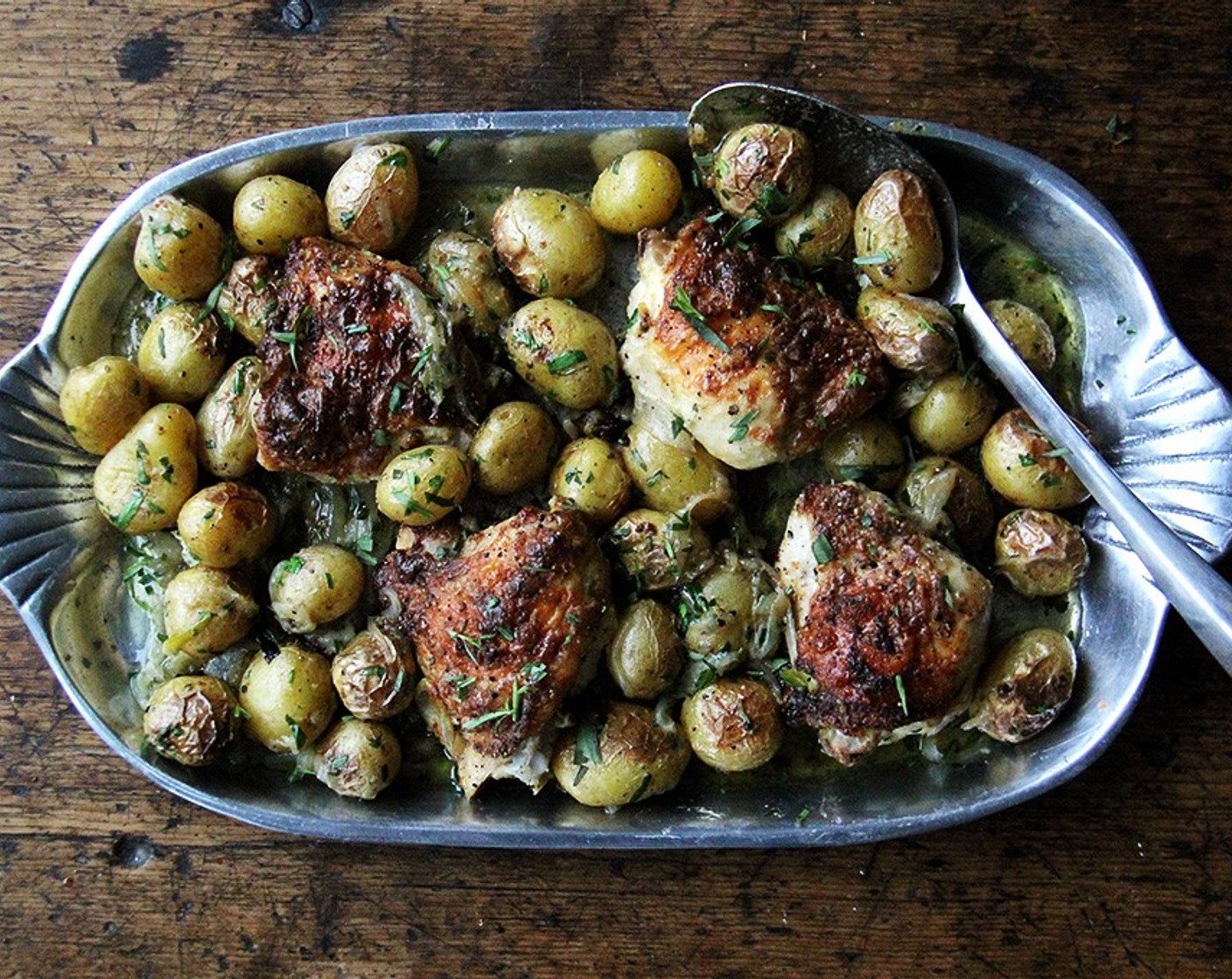 step 7 Toss potatoes with herbs and remaining juices in the pan. Taste. Adjust with more salt or pepper if necessary. Spoon potatoes around chicken on the platter, then serve.