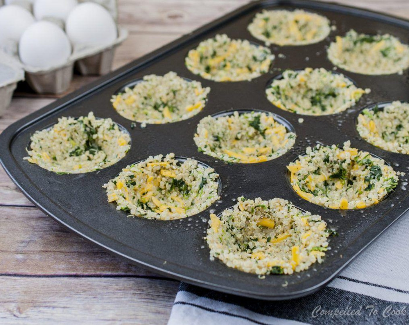 step 4 Spray nonstick muffin tray with non stick spray. Press an approximate 1/4 cup quinoa mixture into muffin tin being sure to press all the way up the sides, creating a cup.