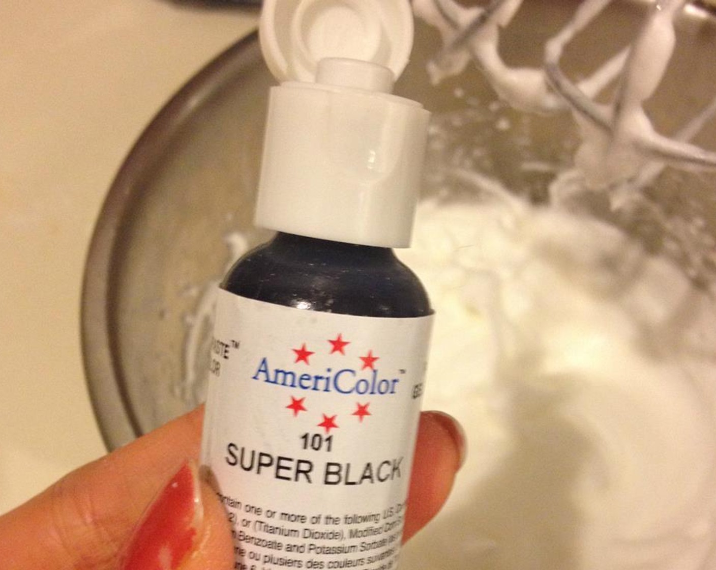 step 6 Mixture B: Beat 1 egg white with Granulated Sugar (1 tsp) until it forms soft peaks, put 3-4 drops of Black Gel Food Coloring (3 drops) in and mix until you reach the color you want.