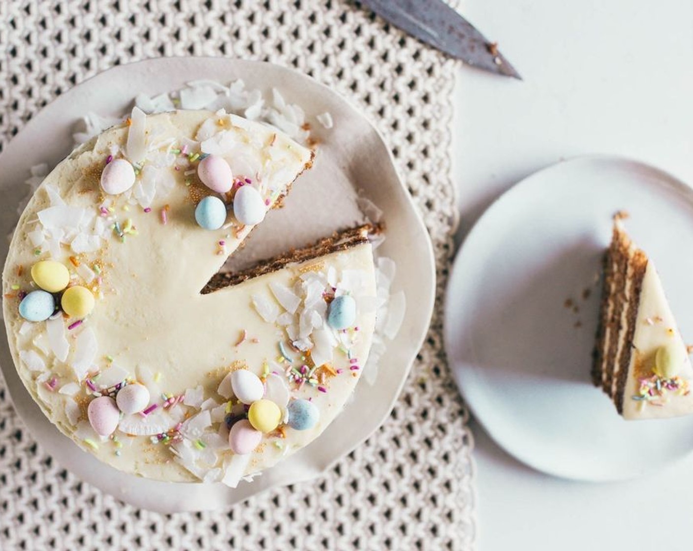 step 12 Layer the frosting with the cooled cakes and sprinkle the top with Unsweetened Coconut Flakes (1/2 cup).