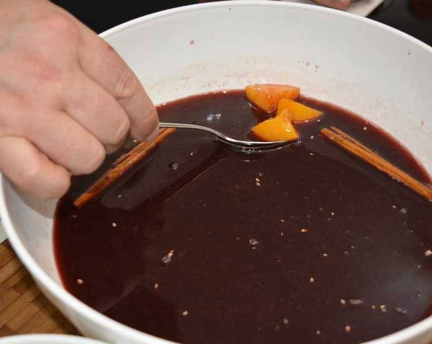 step 2 Remove the chopped peach and cinnamon sticks. Place in the fridge for 2 hours to allow flavors to intensify.