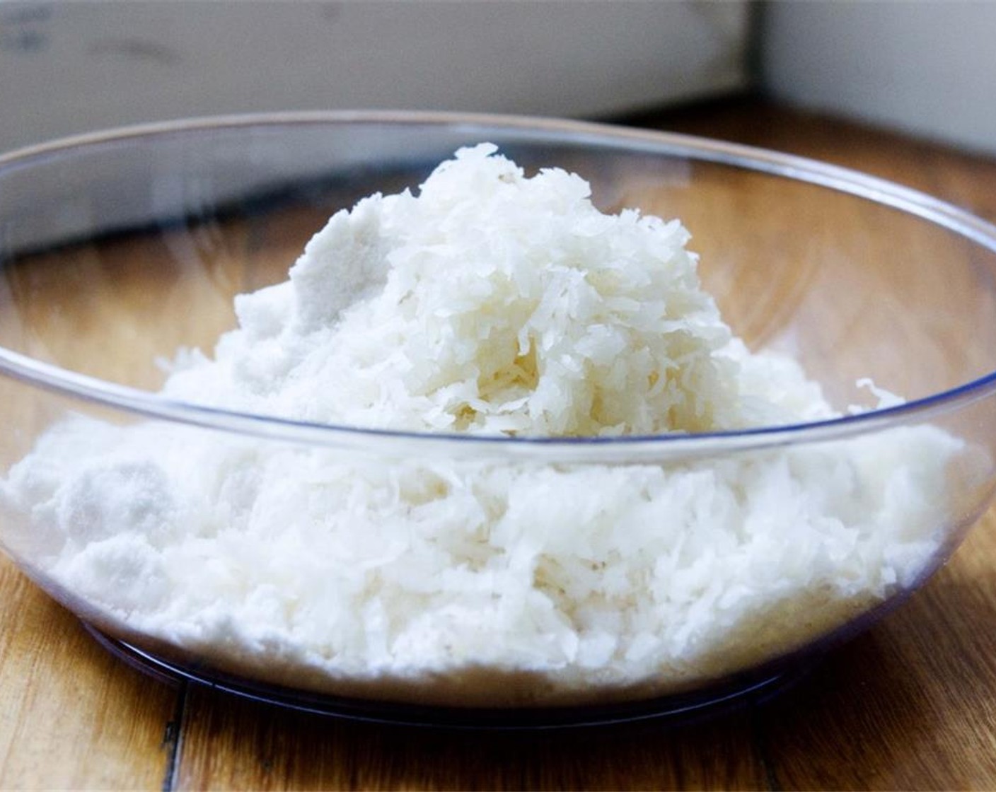 step 2 In a bowl, combine the dry ingredients: Unsweetened Coconut Flakes (1 cup), Unsweetened Shredded Coconut (1/2 cup), and Granulated Sugar (2 Tbsp). Give it a stir.