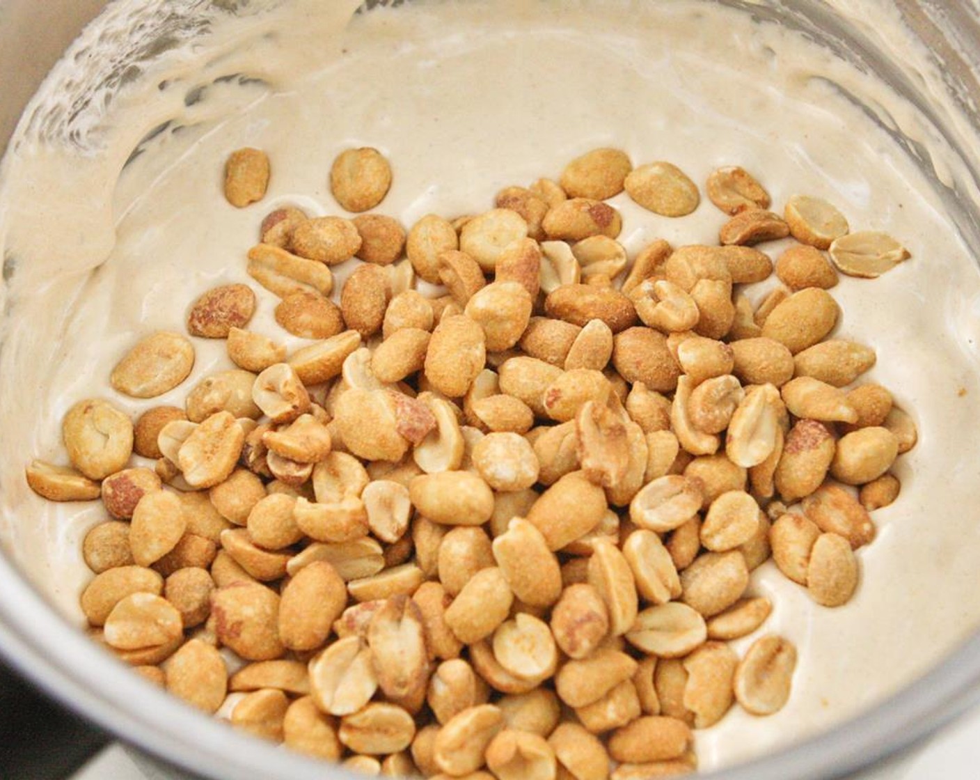 step 8 Add Salted Peanuts (1 cup) and stir until incorporated. Pour mixture over the chocolate layer from the freezer and spread evenly. Place back in freezer.