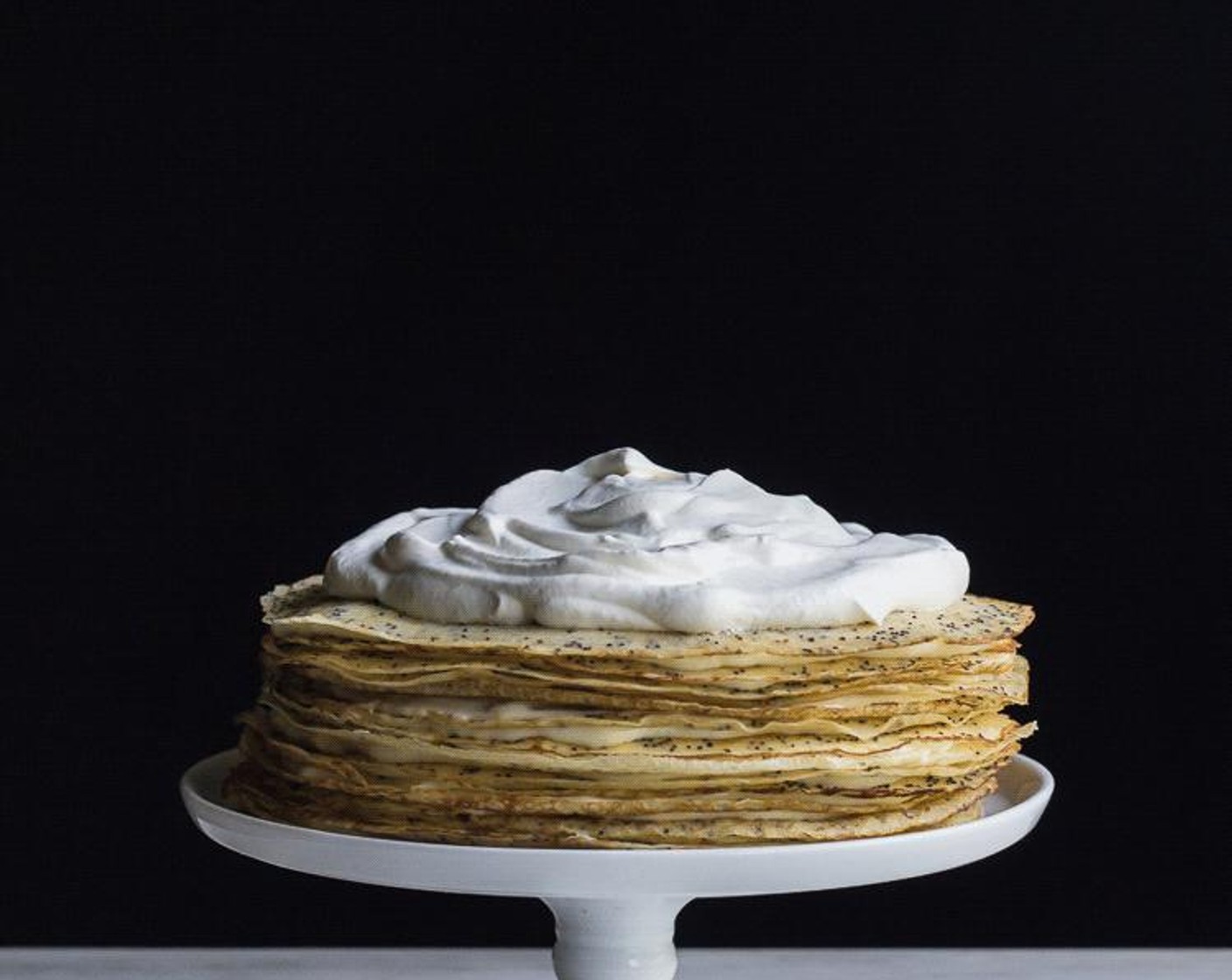 step 15 When ready to serve, whip Whipping Cream (1/2 cup) into soft peaks, top crepe cake with whipped cream and candied lemon slices.