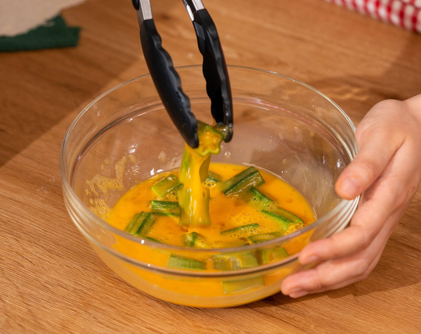 step 3 Toss the Okra (4 1/2 cups) in a bowl with Eggs (4).