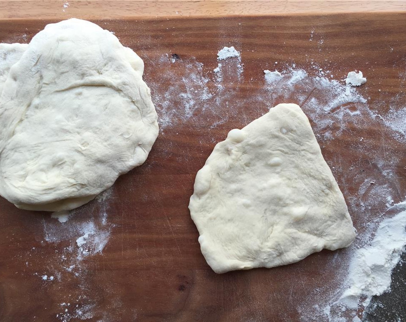 step 11 Use your hands to roll them out. You want them about a quarter-inch thick. Place the dough on squares of parchment paper, so they are easier to work with.