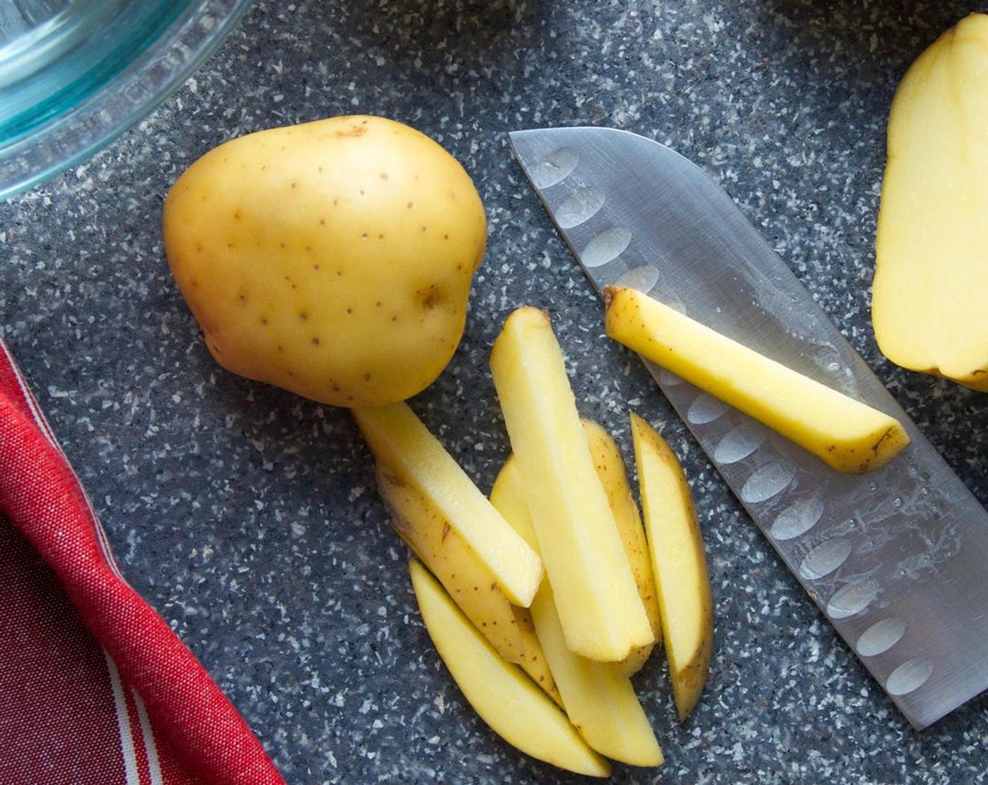 step 1 Fill a large bowl halfway with cold water. Set aside. Using a sharp knife or mandoline, slice the Yukon Gold Potatoes (5) into thin fries (about 1/3 to 1/2-inch thick). Transfer the cut potatoes to the cold water.