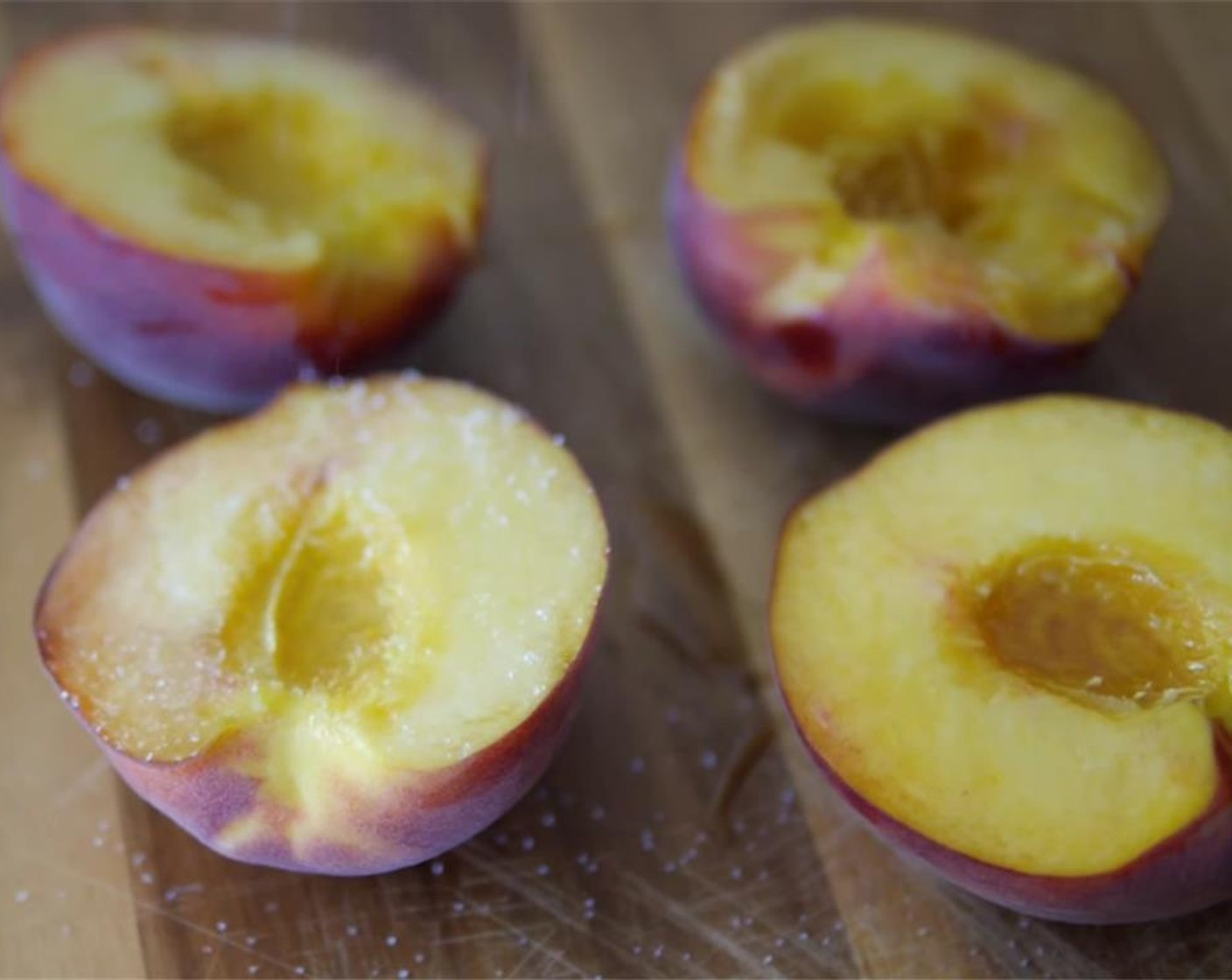 step 1 Mince the Red Chili Pepper (1/2), finely slice the Shallot (1), halve and pit the Peaches (2), zest the Lemon (1), and juice half of it. Set aside. Drizzle the peaches with Oil (as needed) and sprinkle them with a bit of Granulated Sugar (to taste).