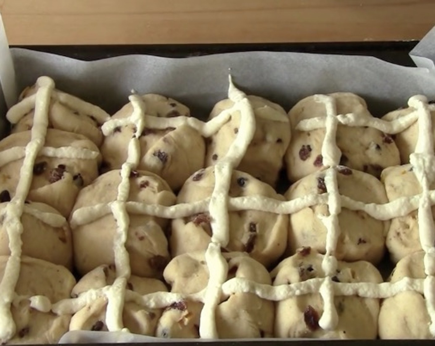 step 8 Mix 1/3 cup of plain flour with a 1/4 cup of water together until it becomes a paste. Spoon the paste into a snap-lock bag and force it all into one corner. Use a scissor to snip off the end and pipe the crosses onto the hot cross buns.