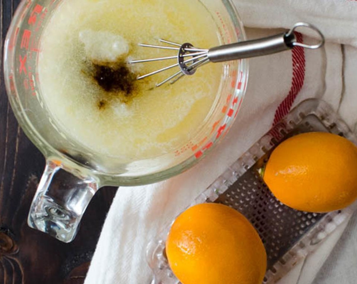 step 2 In a large bowl, whisk together the Milk (1 cup), Canola Oil (1/4 cup), Eggs (2), Lemon Extract (1 tsp), zest and juice from Meyer Lemons (2).