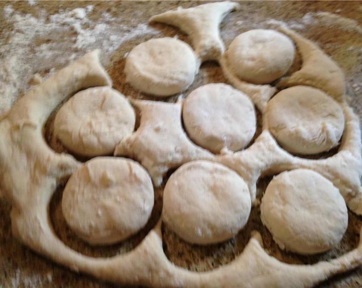 step 8 Cut out biscuits using a 2-inch cookie cutter or a glass that's the similar size. Fold over the remaining dough and cut out remaining biscuits. They won't be as pretty, but it's okay.