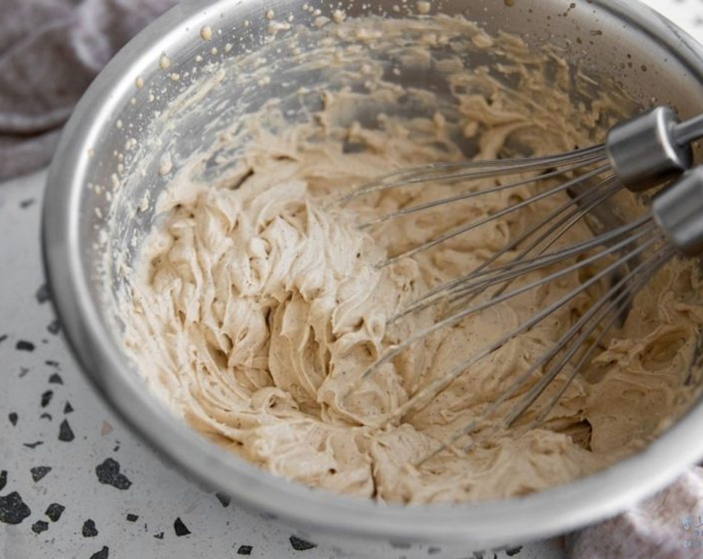 step 2 Strain the heavy cream into a mixing bowl and add Powdered Confectioners Sugar (1/3 cup) and whisk until stiff peaks. Refrigerate until ready to use.
