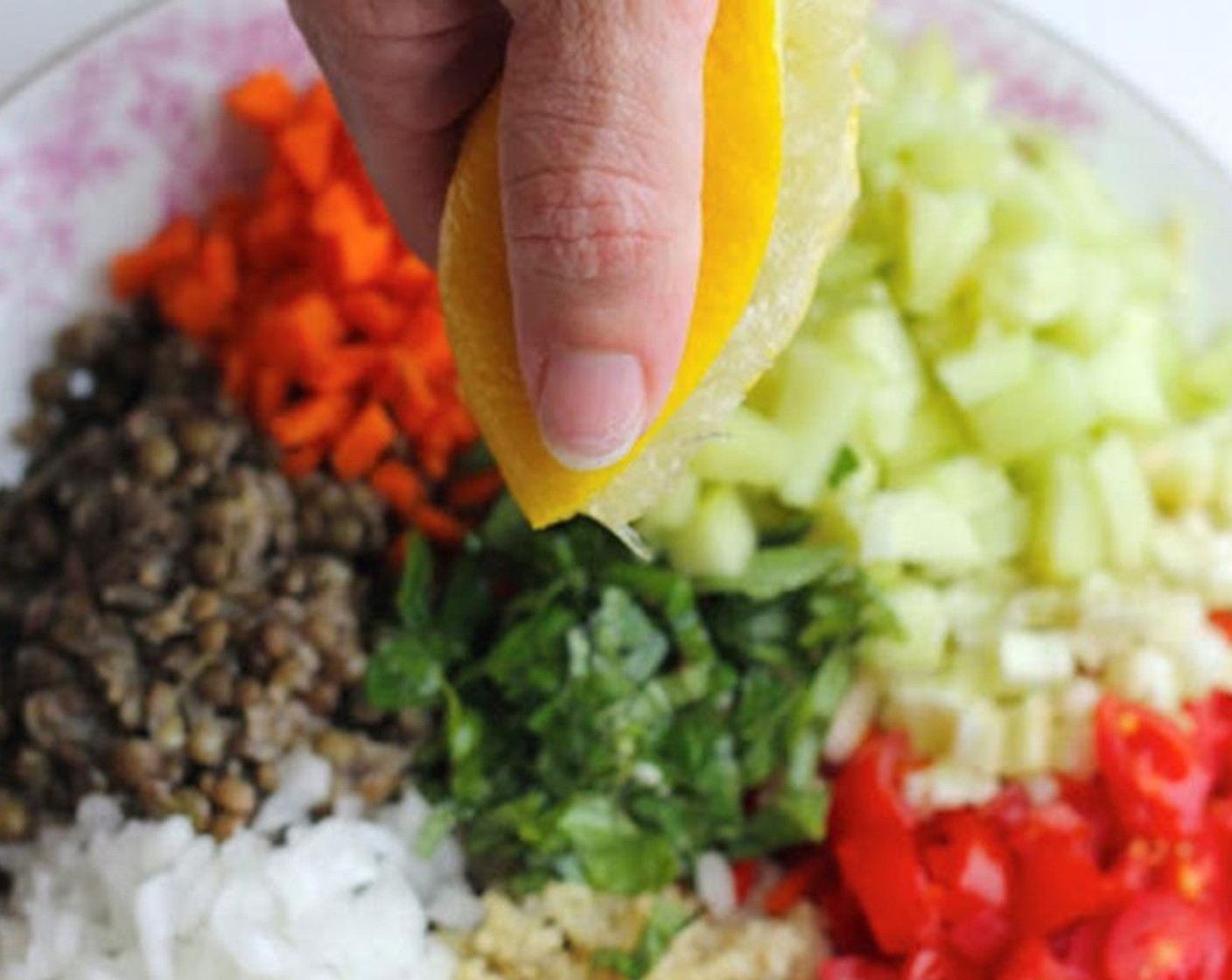 step 1 Place Quinoa (1 1/2 cups), Lentils (1 1/4 cups), Carrot (1), Tomatoes (1 1/2 cups), Onion (1/2), Garlic (1 clove), Celery (1/3 cup), Cucumber (3/4 cup), Fresh Basil (2 Tbsp), Fresh Parsley (2 Tbsp), Fresh Dill (2 Tbsp) in a bowl.  Drizzle with juice from Lemon (1), Olive Oil (2 Tbsp), Salt (to taste), and Ground Black Pepper (to taste).