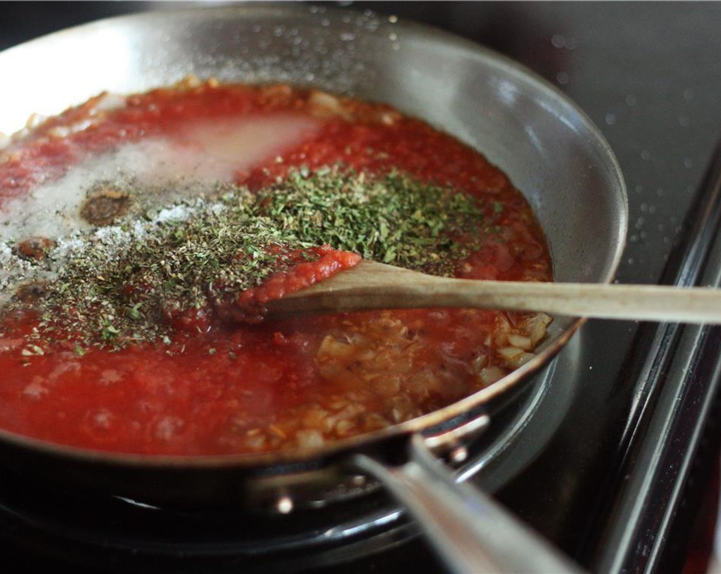 step 2 Add in Tomato Sauce (2 cups), Granulated Sugar (1 Tbsp), Dried Parsley (1 tsp), Dried Thyme (1/4 tsp), Salt (1 tsp), Dried Basil (1 tsp), Dried Oregano (1/2 tsp), and Ground Black Pepper (1 pinch) and bring to a boil. Cook until sauce has reached desired consistency.