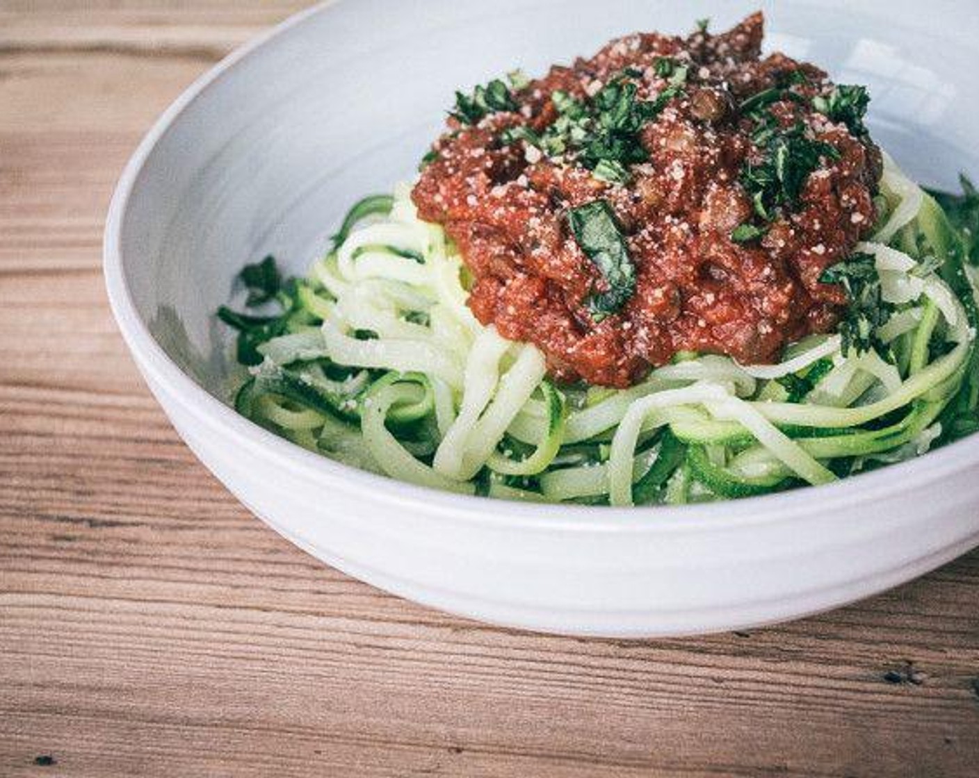 step 6 Divide zucchini spaghetti between two dishes, top with lentil marinara, Fresh Basil (to taste), and Parmesan Cheese (to taste), and enjoy!