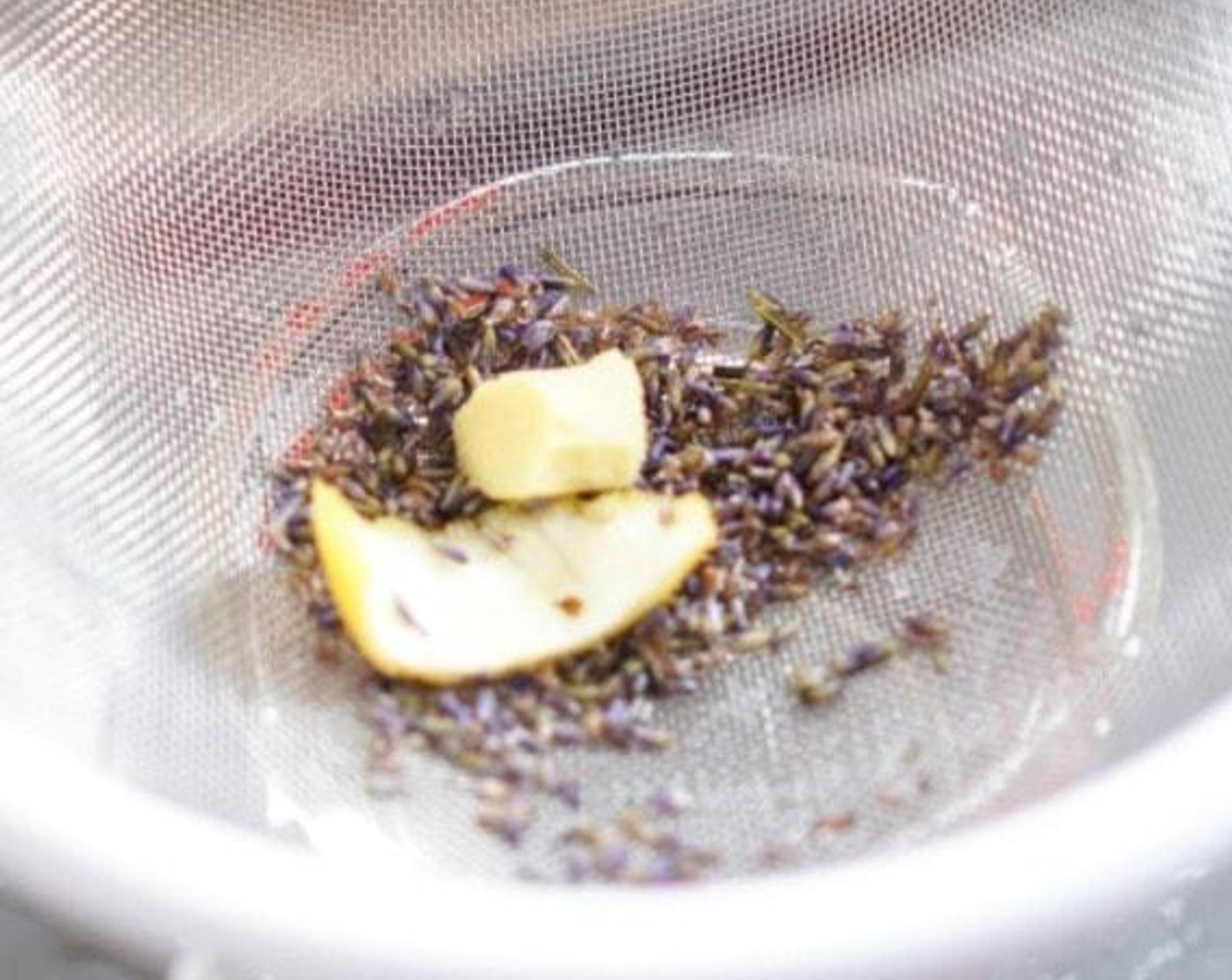 step 3 Add the Lemon Peel, Fresh Ginger (2.5 cm) and Dried Lavender Bulbs (2 Tbsp). Infuse for one hour or overnight in the fridge. Strain, discarding the solids.