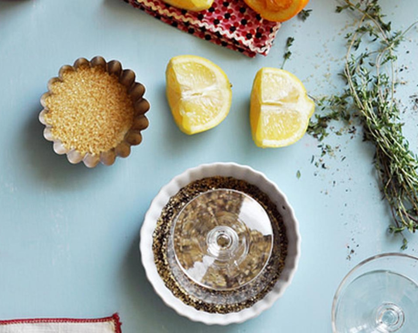 step 4 Combine the Ground Black Pepper (1/4 cup) and Raw Sugar (1/4 cup) in a shallow dish. Cut wedges out of the Lemon (1) Rub the lemon wedge along the edge of the glasses to create a glue. Then dip the glass, upside-down into the shallow dish.