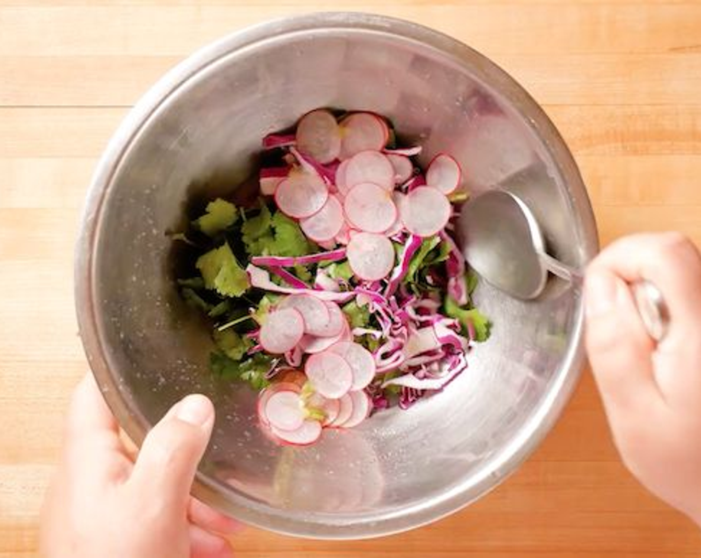 step 7 Toss the Green Cabbage (1 cup), Baby Red Radish (2), Fresh Cilantro (1/2 cup), and Fresh Mint (1/2 cup) in the mixture.