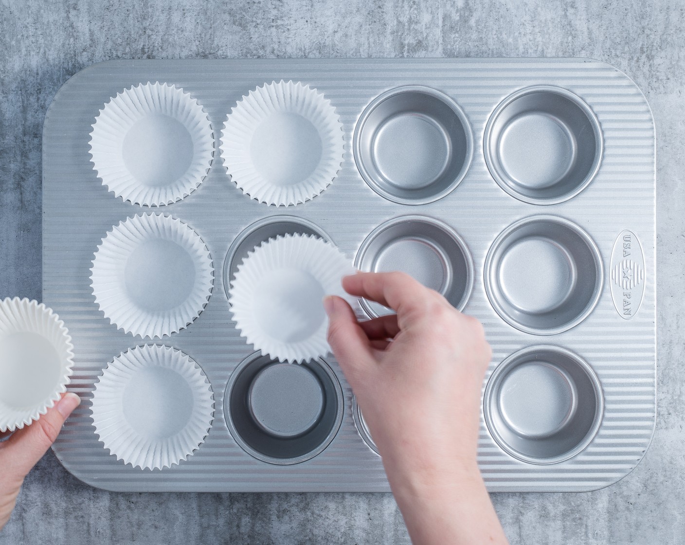 step 1 Preheat your oven to 375 degrees F (190 degrees C). Line a 12-cup muffin pan with paper liners.