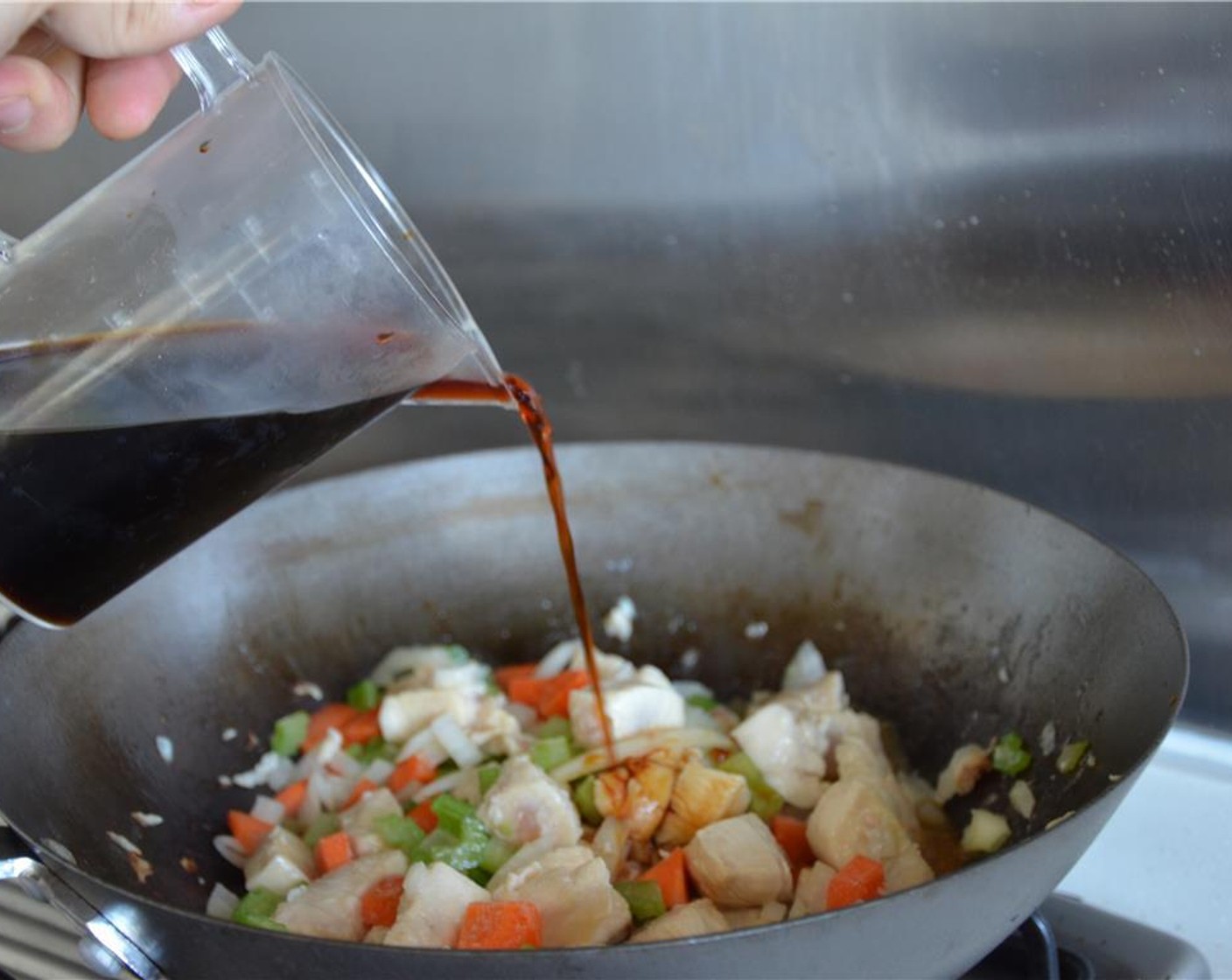 step 8 Add the water and soy sauce mix. Turn heat to low and cook for 15 minutes.