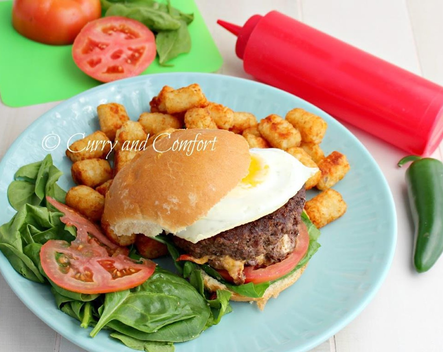 step 10 Place on a toasted burger bun slathered with some Mayonnaise (to taste) garnish with fried Tomato and spinach leaves or Lettuce (to taste).