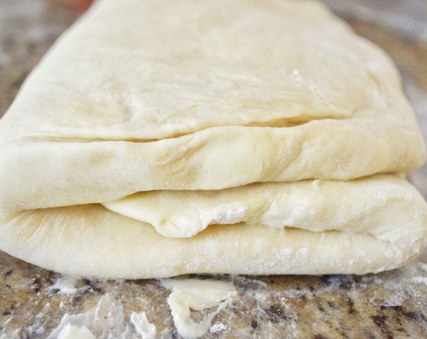 step 8 When the 2 hours is up, repeat the process again of doing two turns with rolling out the dough, folding it, rolling it out again and folding it again. Refrigerate it and let it rest again for 2 hours. This will start to take some real elbow grease and lots of bench flour since you are starting to form some serious layers.