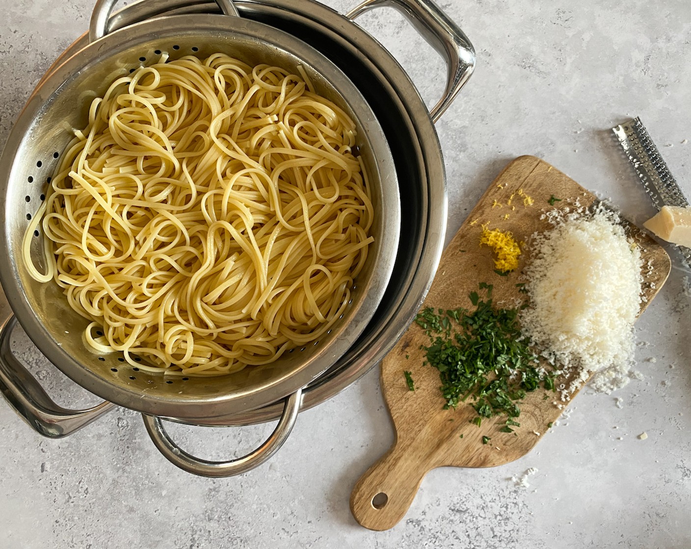 step 9 Drain cooked pasta and toss with Olive Oil (2 Tbsp), Grated Parmesan Cheese (1 cup), and remaining zest. Season with Coarse Salt (to taste) and Freshly Ground Black Pepper (to taste).